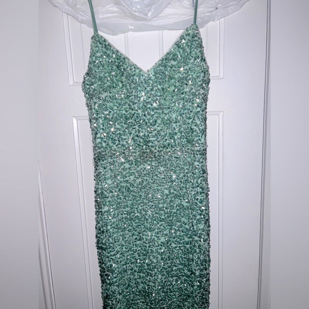 Beautiful sequins evening gown. Worn once. Spaghetti strap with lace up back